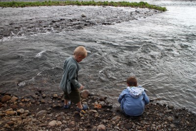 Grandsons throwing stones into the Waiongana Stream. It's actually more like a river!