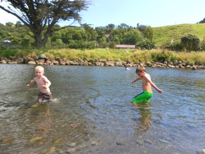 The grandsons are enjoying the river on a lovely summers day.