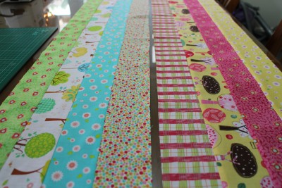 And you end up with two long strips, each of four different materials. Please note these have been pressed neatly. I have my iron out and going the whole time I sew, and press the materials frequently.