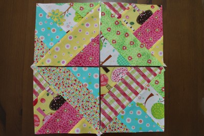 Press the seams and turn over. Voila! Look at that! Aren't they so pretty! These four have been placed making a little mixed square in the centre.