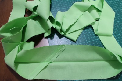The next stage is the binding. I cut three inch strips and joined them together to make one big long strip. Fold it in half and iron the fold.