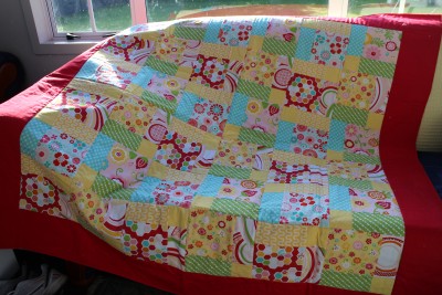 I have fast tracked the project. If you want to see how to put the wadding and backing material onto the patchwork, you can look at my previous blog post. I did do one thing different this time though... As it was a larger blanket, I used fabric spray on glue to help hold the materials together. It washes out and causes no long term damage to the blanket, but it certainly makes life a whole lot easier when it comes to the top stitching :-)