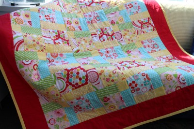 And here is the finished blanket with a cute little narrow yellow binding. This blanket is a 1 and 3/4 meter square one. Plenty big enough to cuddle under :-)